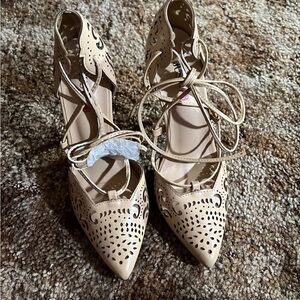 Cream Heels with Intricate Perforation and Lace-Up Design